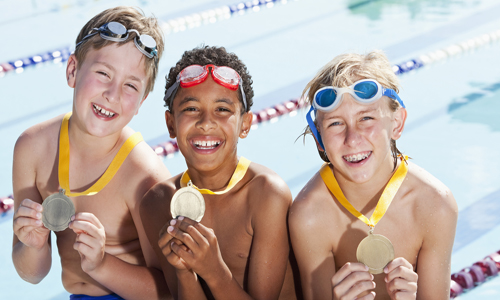 Boys with swimming medals